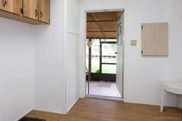 a view of a porch with furniture and a yard