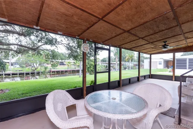 a bedroom with furniture and a chandelier
