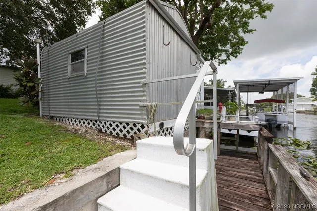 a view of backyard with a table and chairs