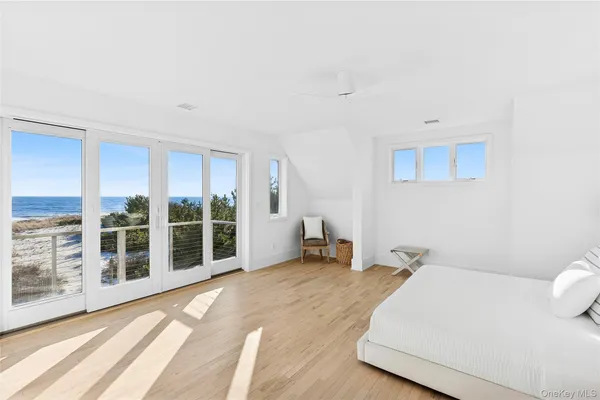 a bed room with a bed and a large window