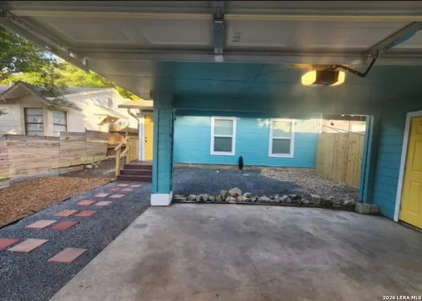 a view of a building with a yard