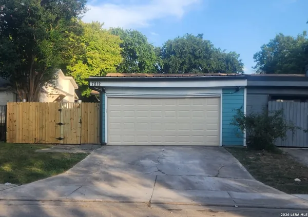 a view of a house with a garage