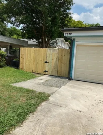 a view of a back yard of the house
