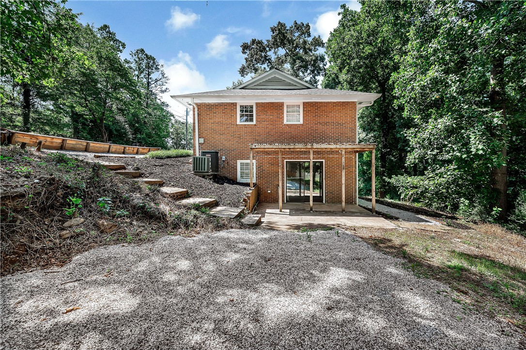 2011 Forest Drive Seneca, SC 29672 - Photo 4 of 36 Brick exterior offers a private retreat surrounded by mature trees and natural landscaping.