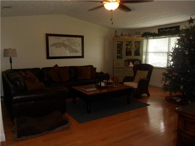 4561 Southeast Shady Ridge Lane Stuart, FL 34997 - Photo 4 of 25 a living room with furniture and a window
