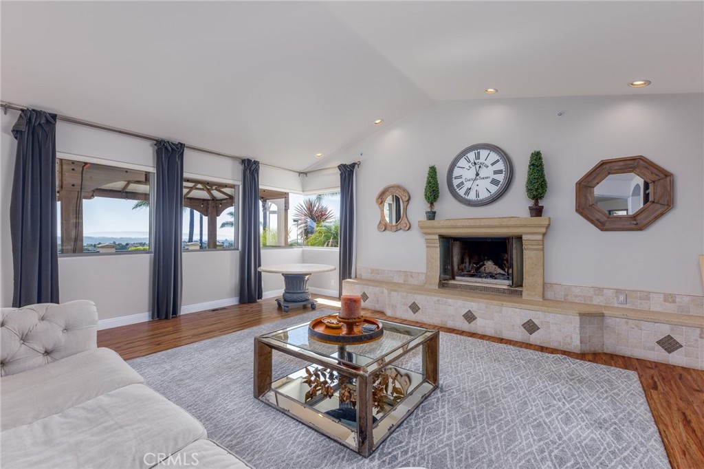 515 Windermere Lane Arroyo Grande, CA 93420 - Photo 11 of 75 a living room with furniture a clock and a fireplace