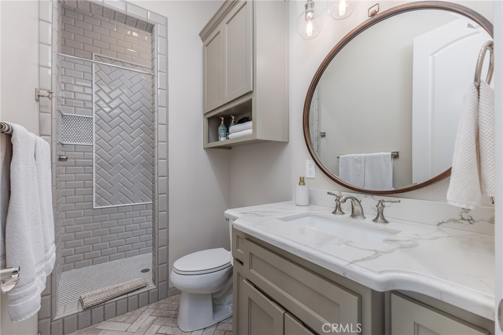 515 Windermere Lane Arroyo Grande, CA 93420 - Photo 56 of 75 a bathroom with a sink a toilet and a mirror