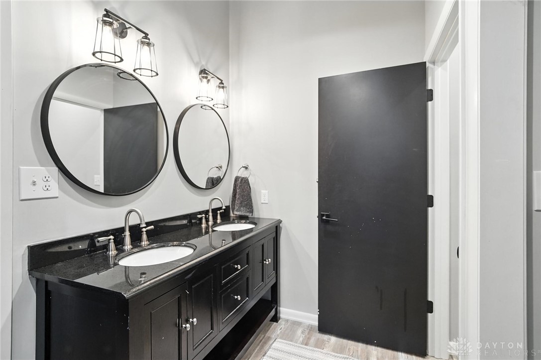 9258 Clyo Road Dayton, OH 45458 - Photo 49 of 68 upstairs bathroom with double sink vanity and large walk in shower.