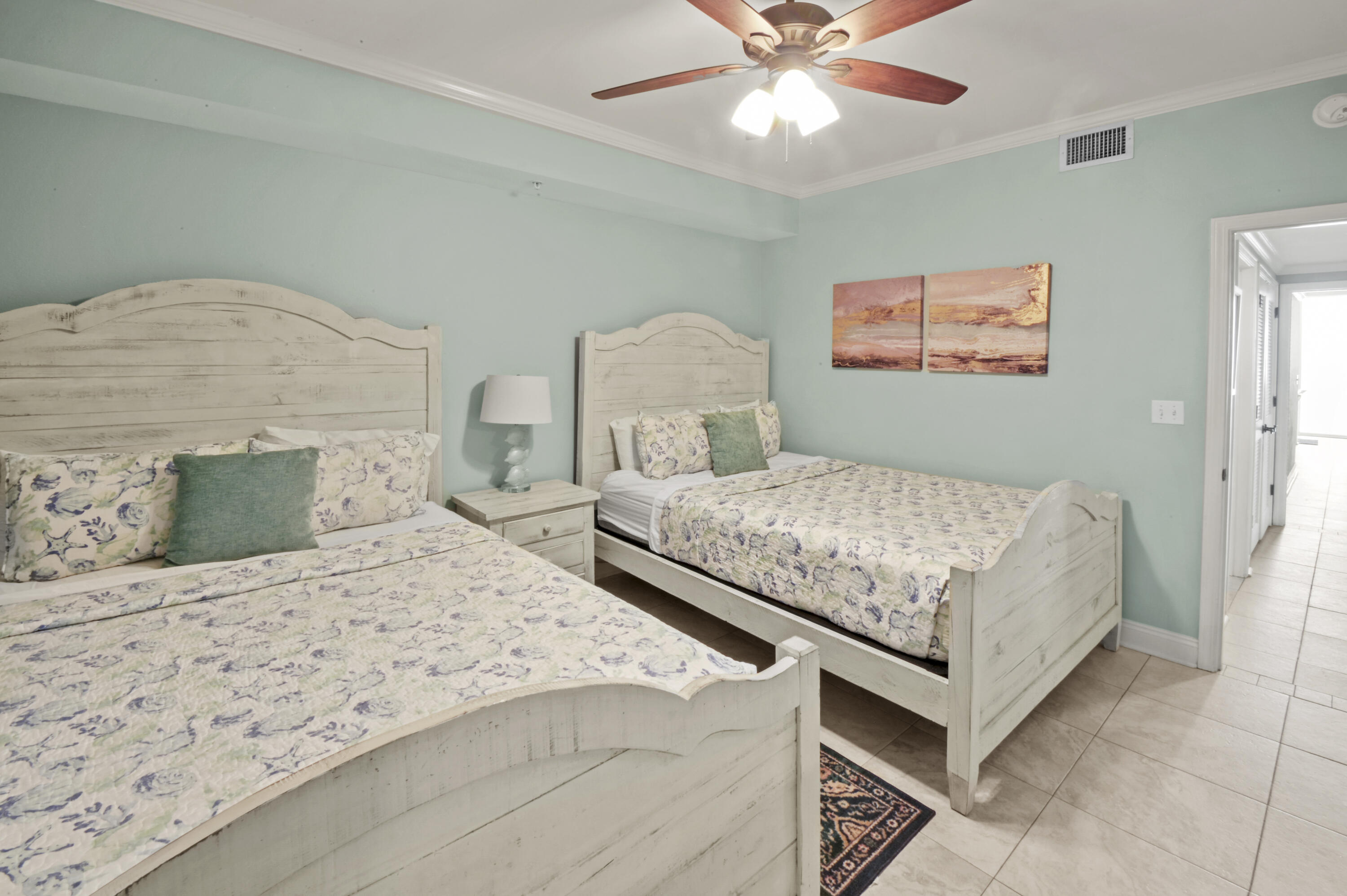 8477 Gulf Boulevard, Unit 902 Navarre, FL 32566 - Photo 20 of 36 a bedroom with a bed and a chandelier