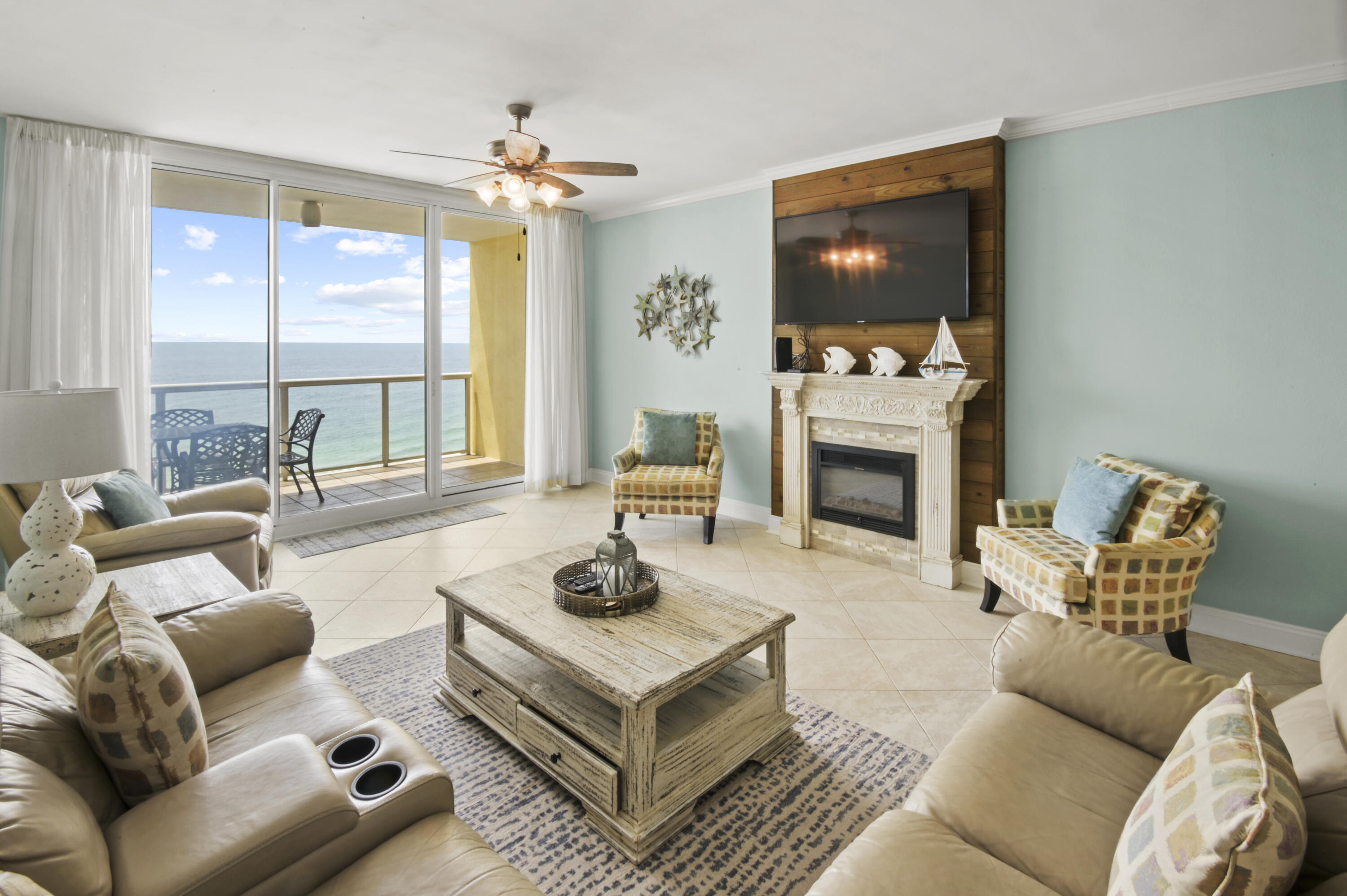 8477 Gulf Boulevard, Unit 902 Navarre, FL 32566 - Photo 2 of 36 a living room with furniture and a fireplace