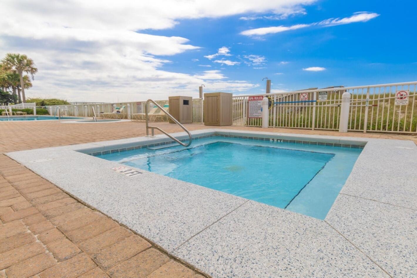 8477 Gulf Boulevard, Unit 902 Navarre, FL 32566 - Photo 29 of 36 a view of a swimming pool with an outdoor seating