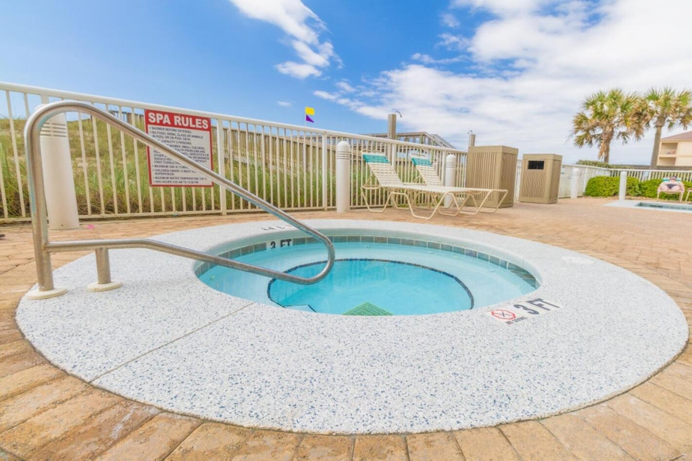 8477 Gulf Boulevard, Unit 902 Navarre, FL 32566 - Photo 30 of 36 a view of a swimming pool with a porch