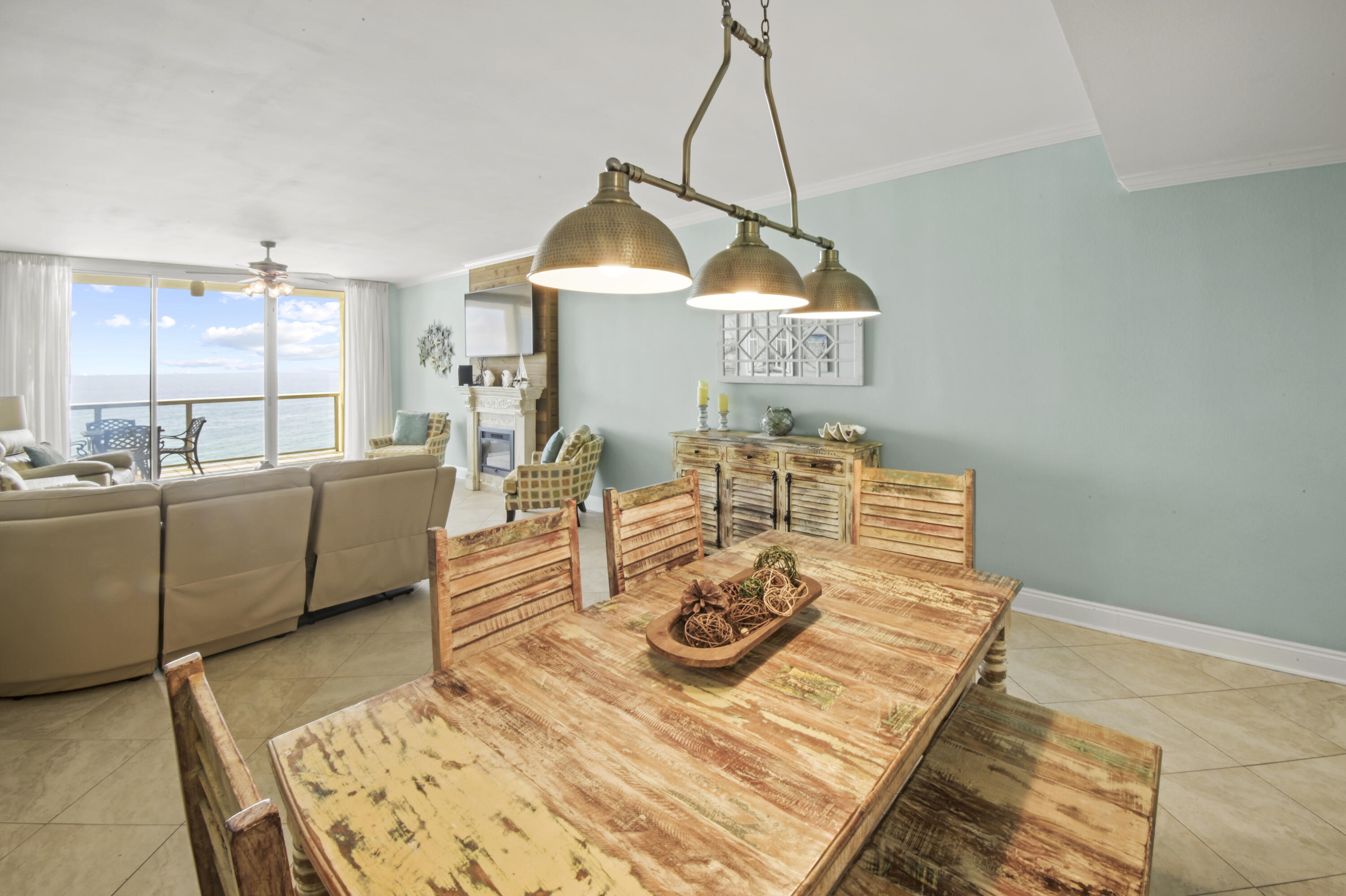 8477 Gulf Boulevard, Unit 902 Navarre, FL 32566 - Photo 5 of 36 a living room with furniture and a chandelier