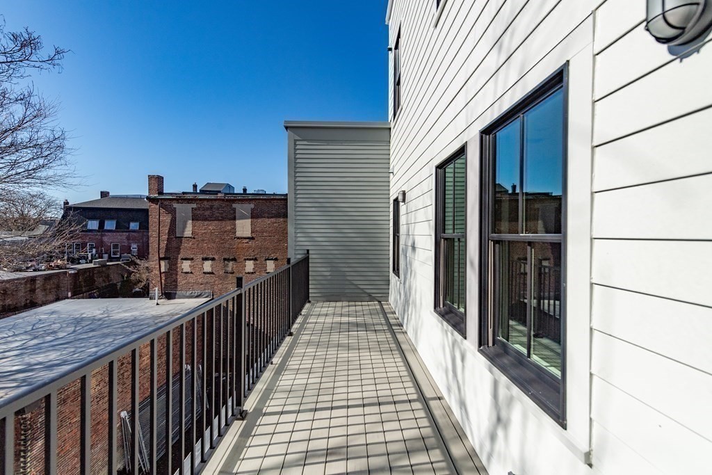 120 Brookside Avenue, Unit 203 Boston, MA 02130 - Photo 7 of 18 a view of a balcony with wooden floor