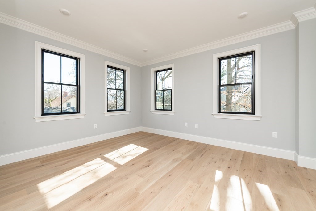 120 Brookside Avenue, Unit 203 Boston, MA 02130 - Photo 9 of 18 a view of an empty room with windows