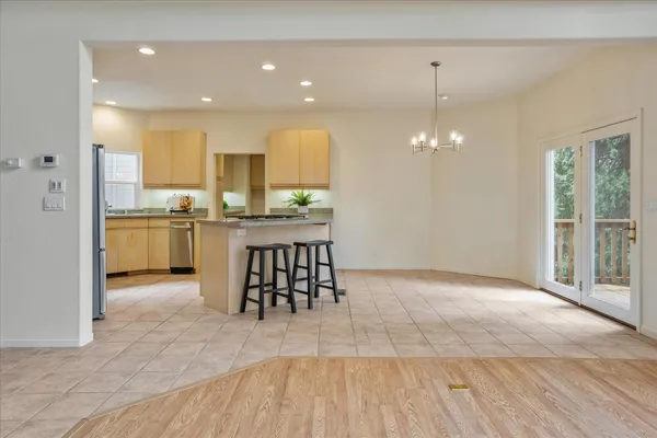 a kitchen with granite countertop a refrigerator and a stove