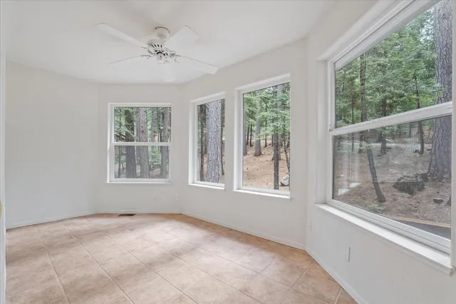a view of a room with wooden floor and a window