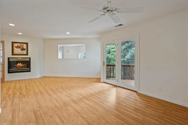 a bath tub sitting in a bathroom next to a window