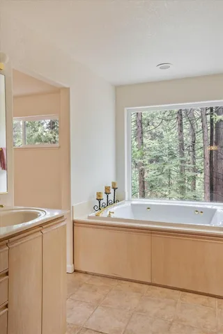 a kitchen with a table and chairs