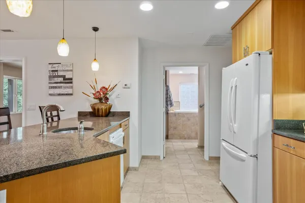 a spacious bedroom with a bed and ceiling fan