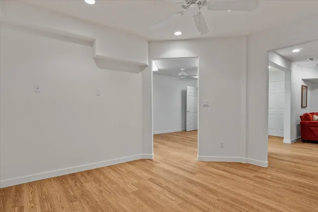 a view of a hallway with windows