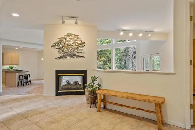 a view of a livingroom with furniture and a kitchen