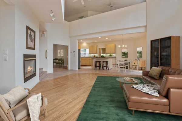 a kitchen with stainless steel appliances granite countertop a stove refrigerator sink and cabinets