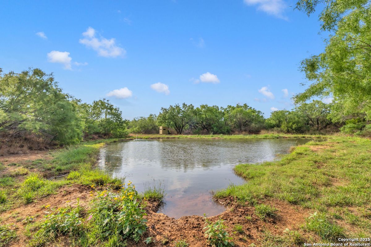 2654 Mathews Rnch Road Dilley, TX 78017 - Photo 20 of 39 a view of a lake with a lake in the background
