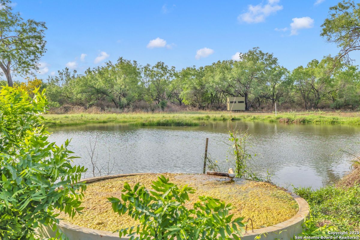 2654 Mathews Rnch Road Dilley, TX 78017 - Photo 24 of 39 a view of a lake in between two chairs