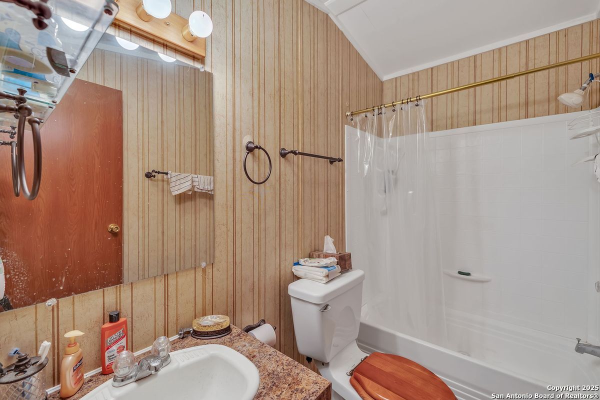 2654 Mathews Rnch Road Dilley, TX 78017 - Photo 33 of 39 a bathroom with a granite countertop sink toilet and shower