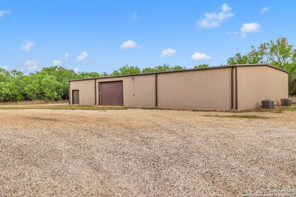 a view of a tables and chairs in a patio