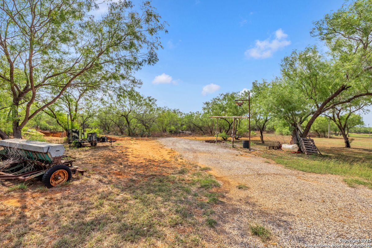 2654 Mathews Rnch Road Dilley, TX 78017 - Photo 7 of 39 a view of a yard with car parked