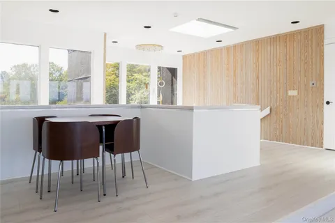 a view of a dining room with furniture window and outside view