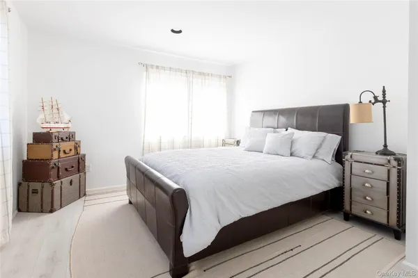 a bedroom with a bed and a tv