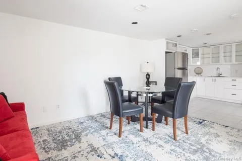 a kitchen with a refrigerator a sink and cabinets