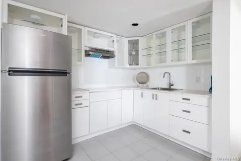 a bedroom with two beds and painting on the wall