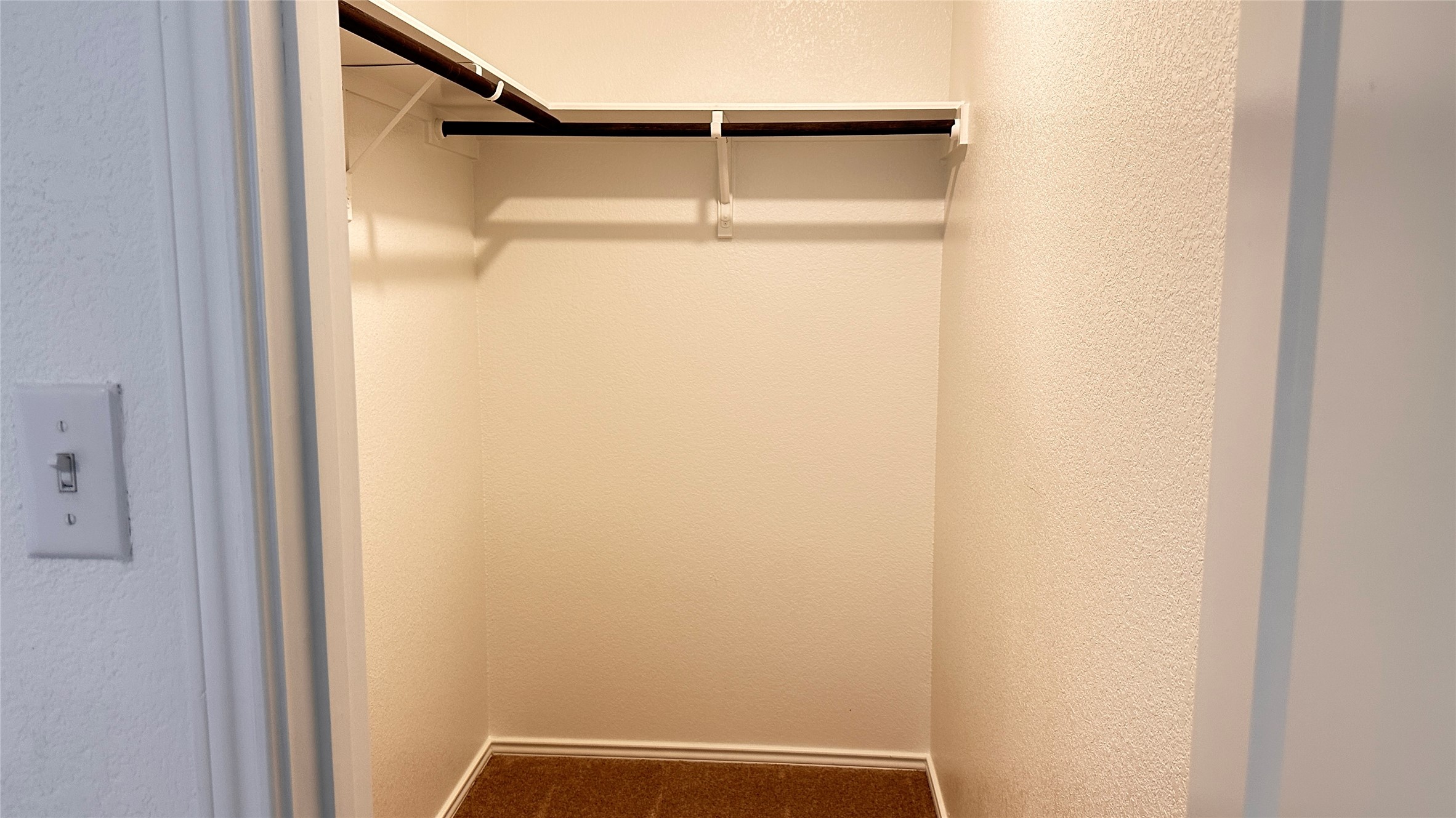 138 Milliner Loop Hutto, TX 78634 - Photo 26 of 36 Walk in closet with dark colored carpet