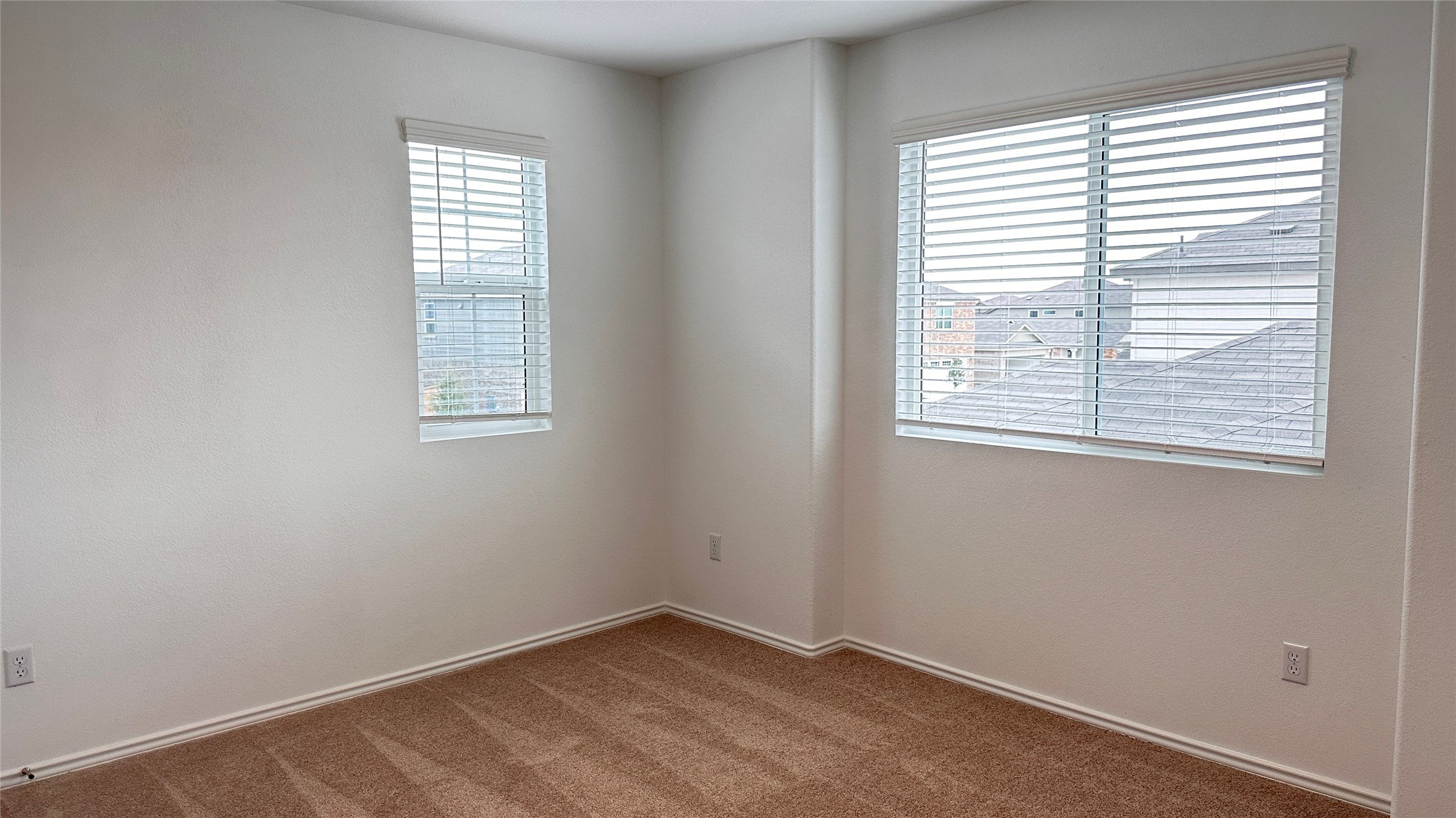 138 Milliner Loop Hutto, TX 78634 - Photo 28 of 36 Unfurnished room featuring carpet floors and baseboards
