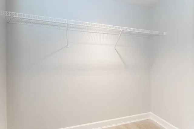 a view of an empty room and a window