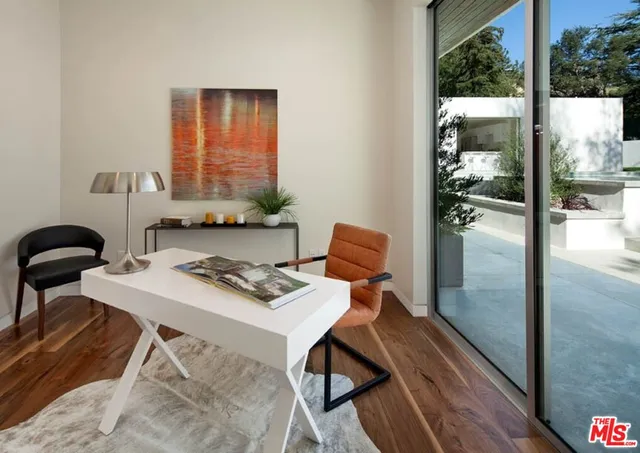 a workspace with furniture and window