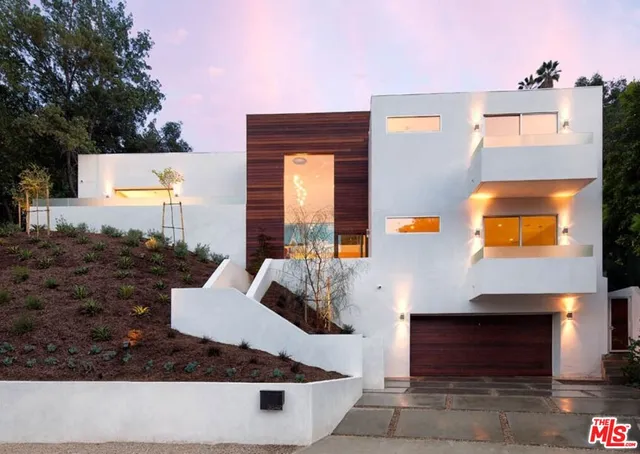 a front view of a house with entertaining space