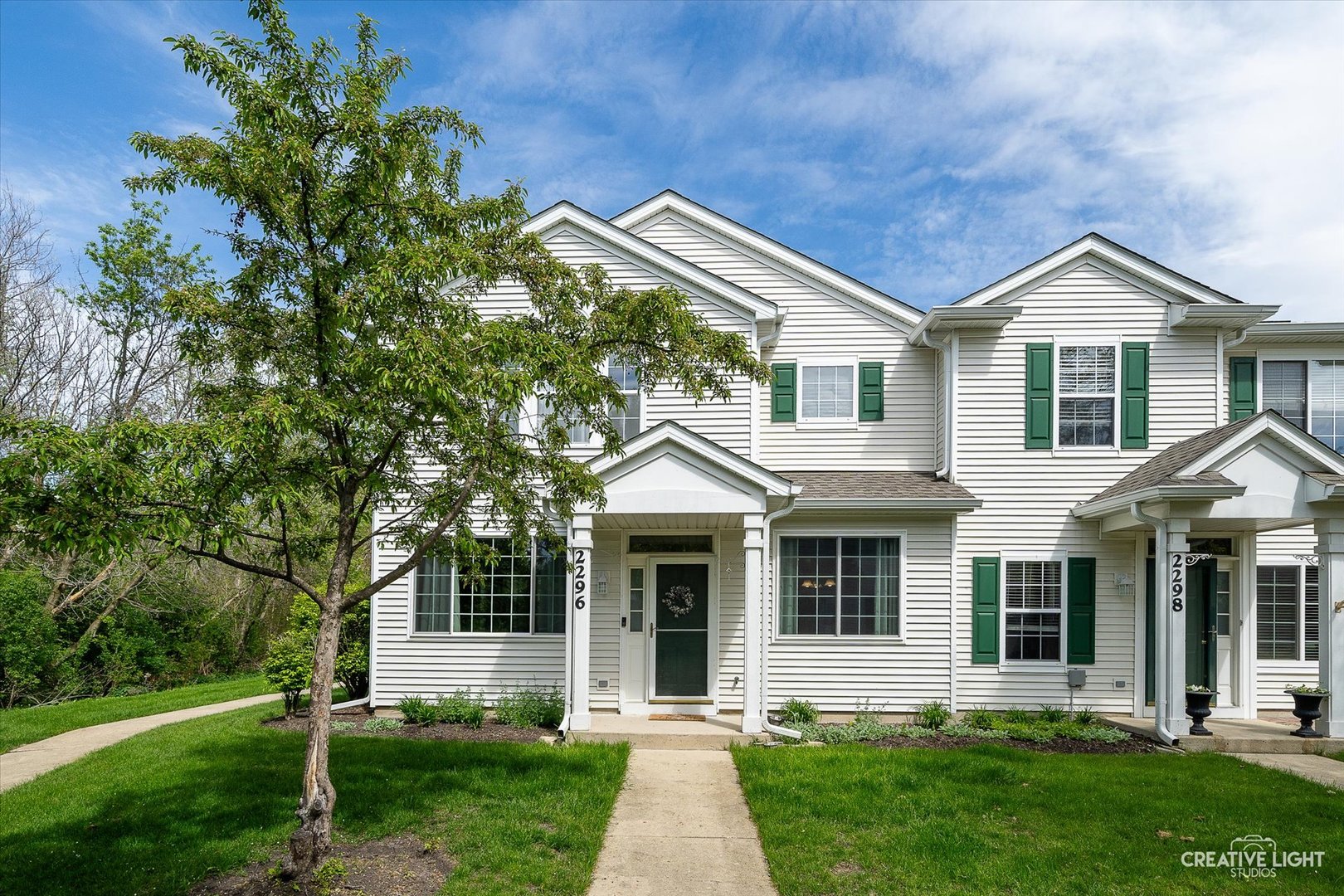 2296 Reflections Drive, Unit 2296 Aurora, IL 60502 - Photo 1 of 32 front view of a house with a yard