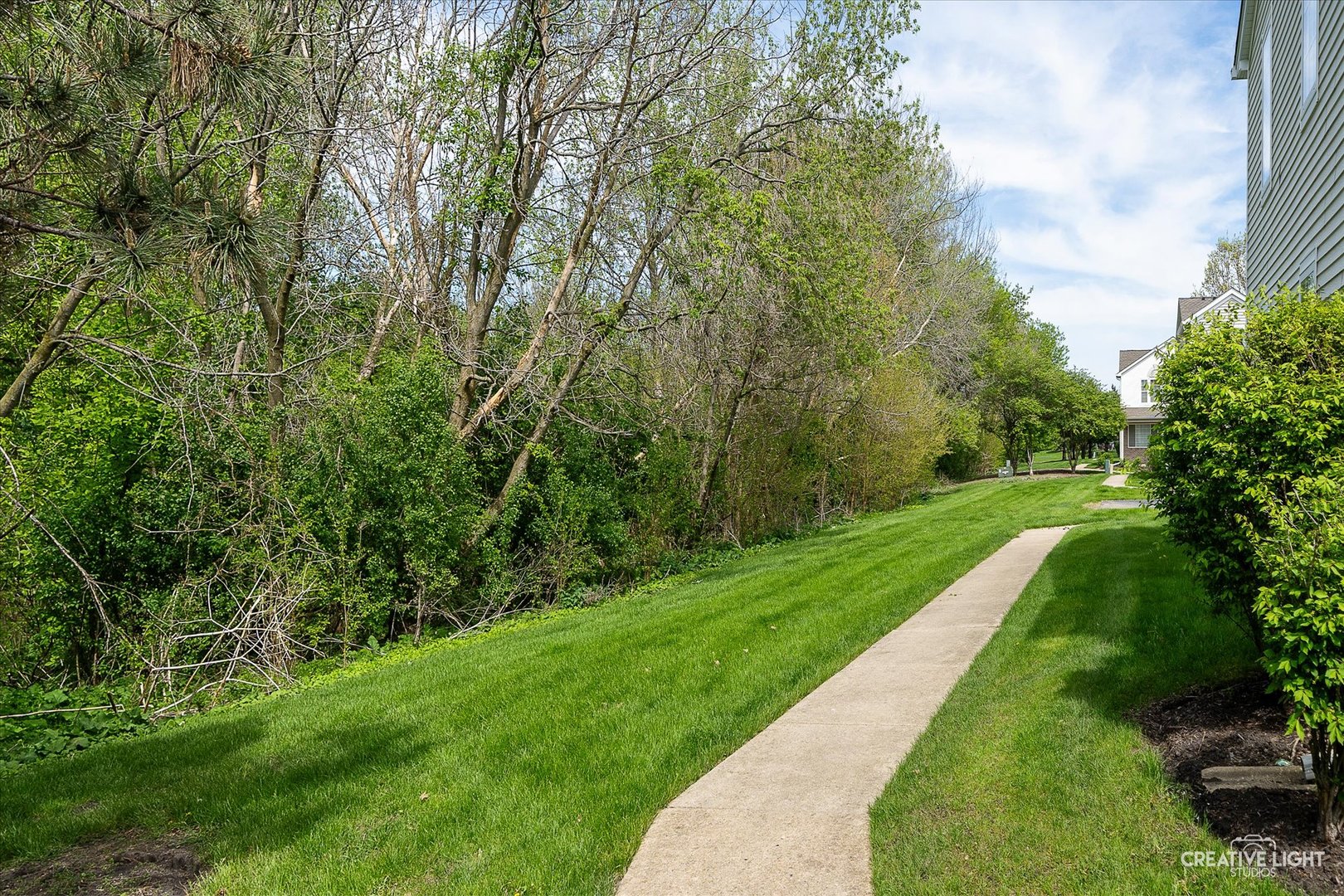 2296 Reflections Drive, Unit 2296 Aurora, IL 60502 - Photo 32 of 32 a view of green field with trees in the background