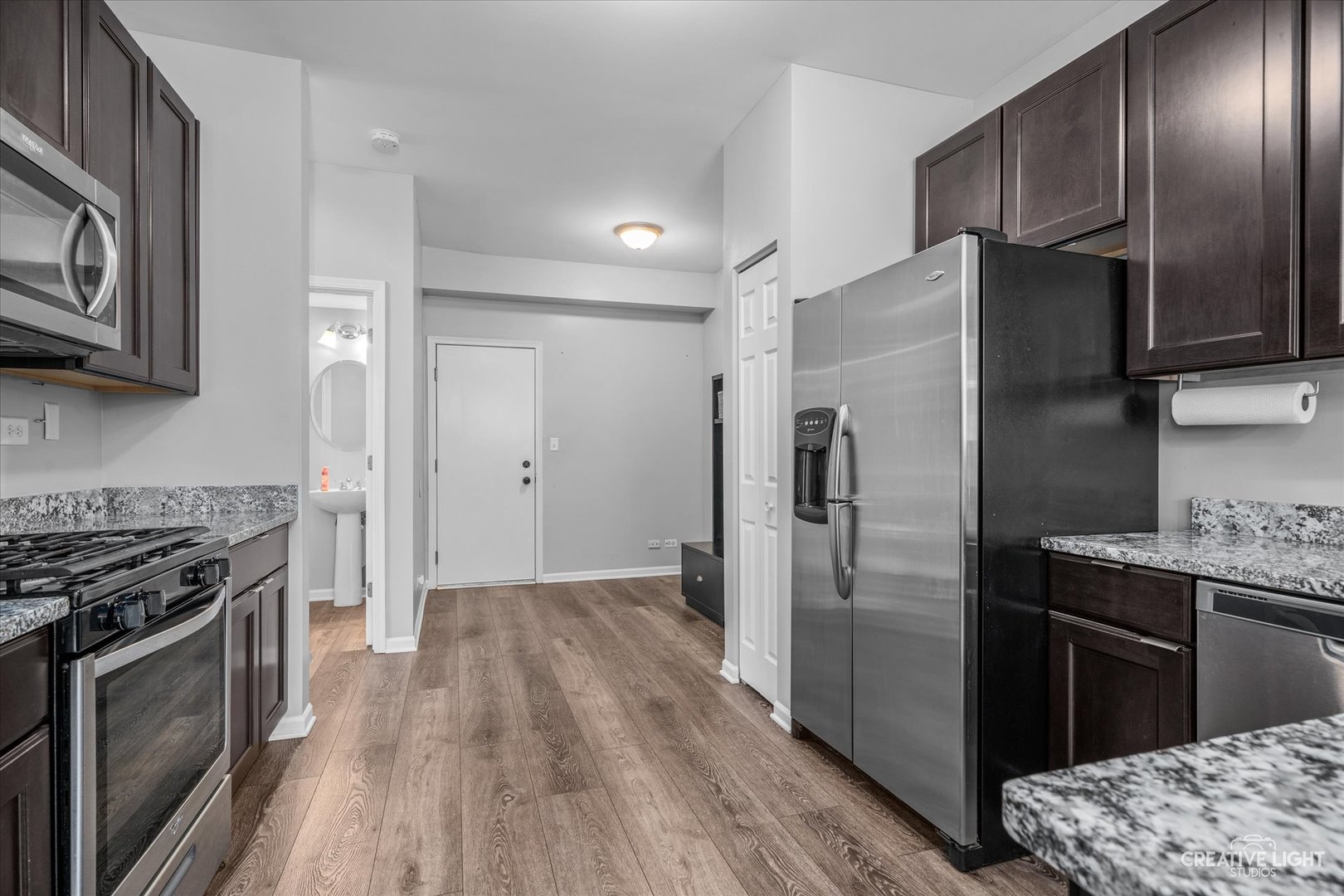 2296 Reflections Drive, Unit 2296 Aurora, IL 60502 - Photo 5 of 32 a kitchen with stainless steel appliances granite countertop a refrigerator stove and sink