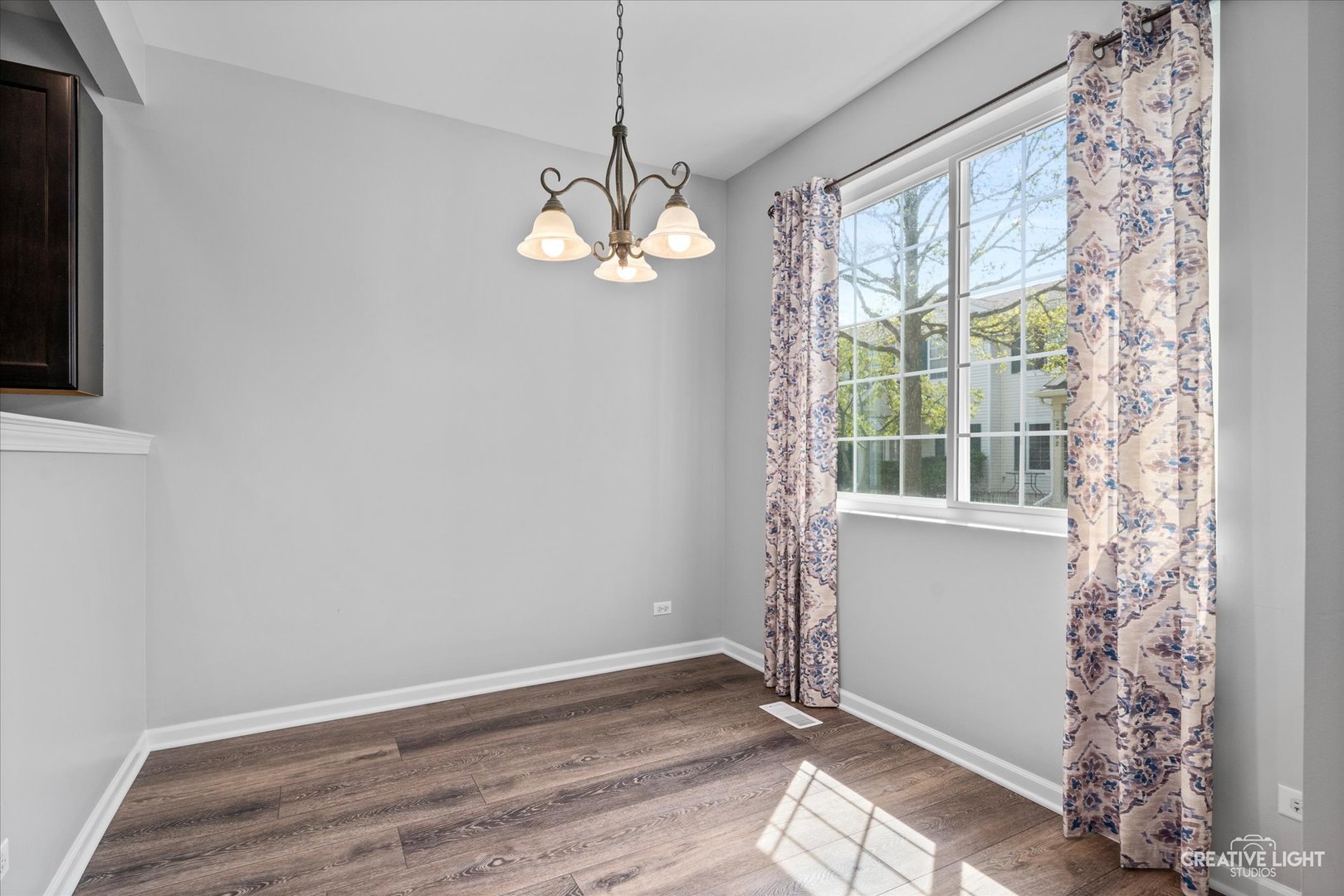2296 Reflections Drive, Unit 2296 Aurora, IL 60502 - Photo 7 of 32 a view of an empty room with a window