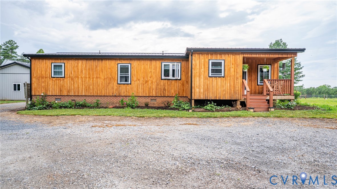 1451 Dixie Hill Road Dillwyn, VA 23936 - Photo 33 of 51 Exterior featuring horizontal wood siding, a cover