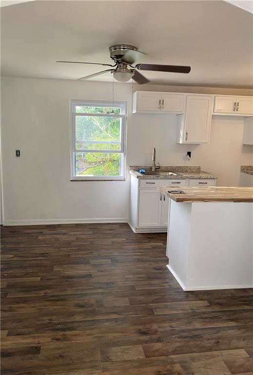 2031 McKinney Road Monroeville, PA 15146 - Photo 5 of 13 a view of a kitchen with stainless steel appliances granite countertop a stove a sink and white cabinets with wooden floor