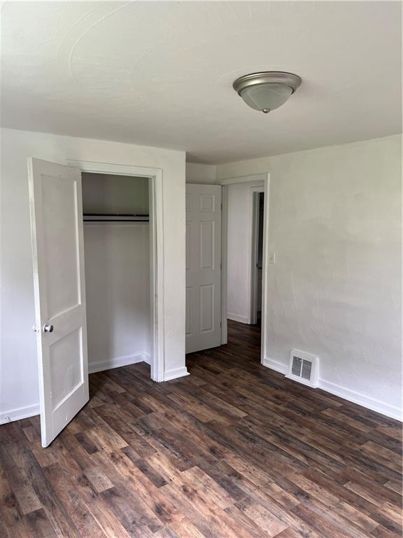 2031 McKinney Road Monroeville, PA 15146 - Photo 7 of 13 an empty room with wooden floor and closet