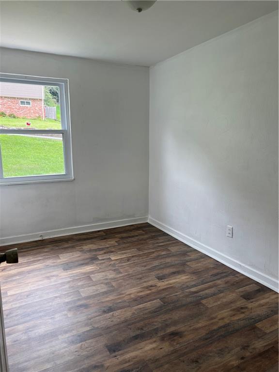 2031 McKinney Road Monroeville, PA 15146 - Photo 8 of 13 a view of an empty room with wooden floor and a window