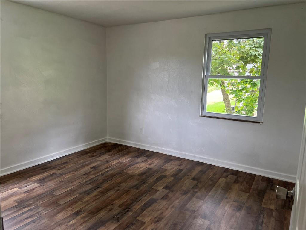 2031 McKinney Road Monroeville, PA 15146 - Photo 9 of 13 a view of an empty room with wooden floor and a window